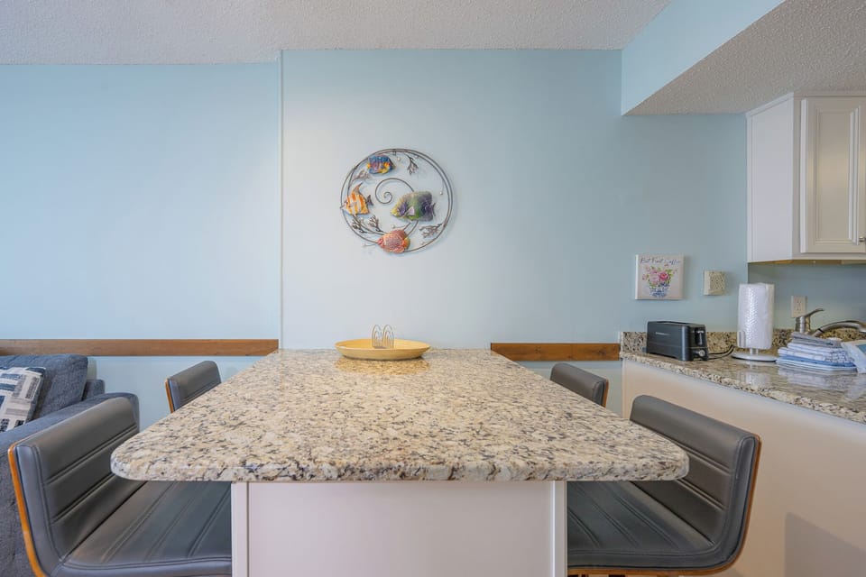 Gather around the dining area with family, sharing laughter and memories in your cozy vacation retreat