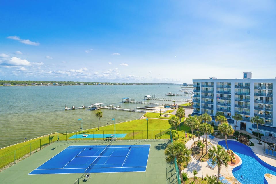 Soak in stunning lagoon views as you enjoy lively matches on the tennis courts, embraced by the coastal vibe
