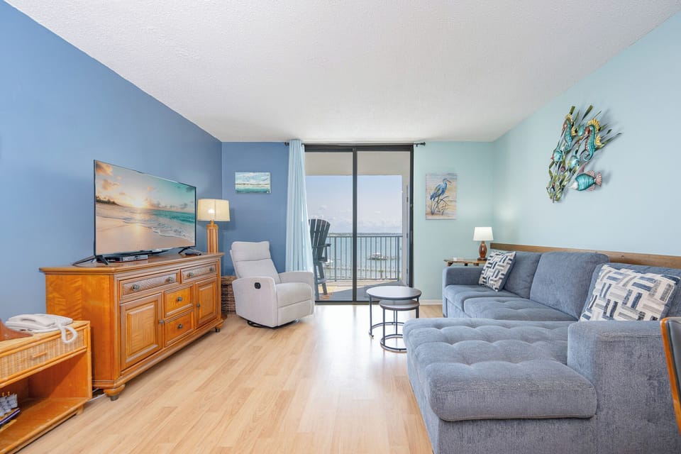 Unwind in the cozy seating, taking in the lagoon views while enjoying your favorite shows on the large TV