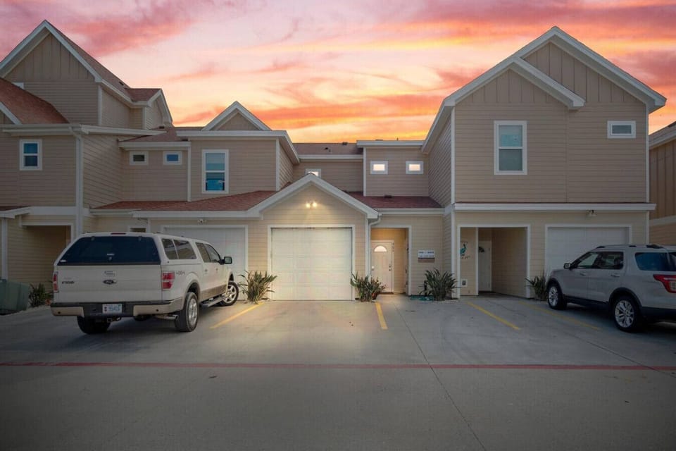 Front exterior of Beachside 503 at sunset.