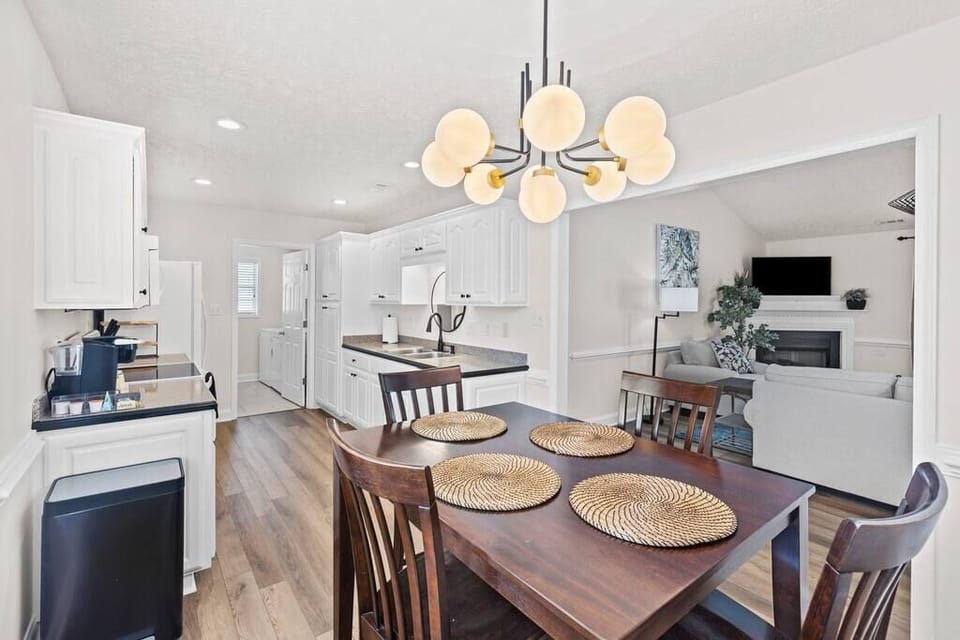 Eat-in kitchen with full refrigerator, oven, stove, dish washer, Kreig coffee maker, toaster