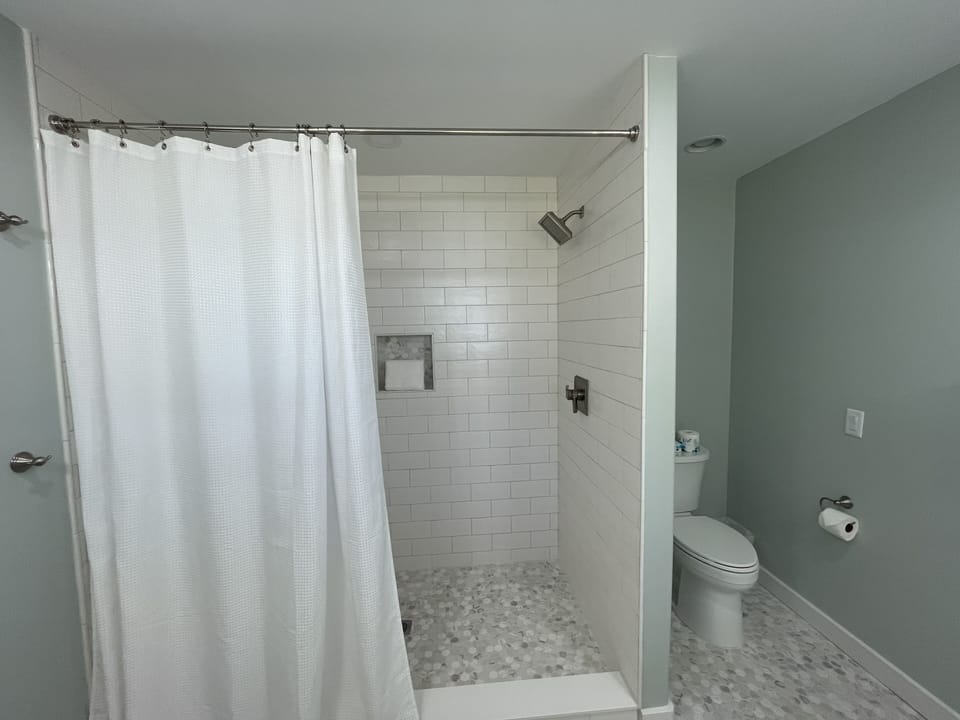 Master bath large walk in shower with rain shower head. 