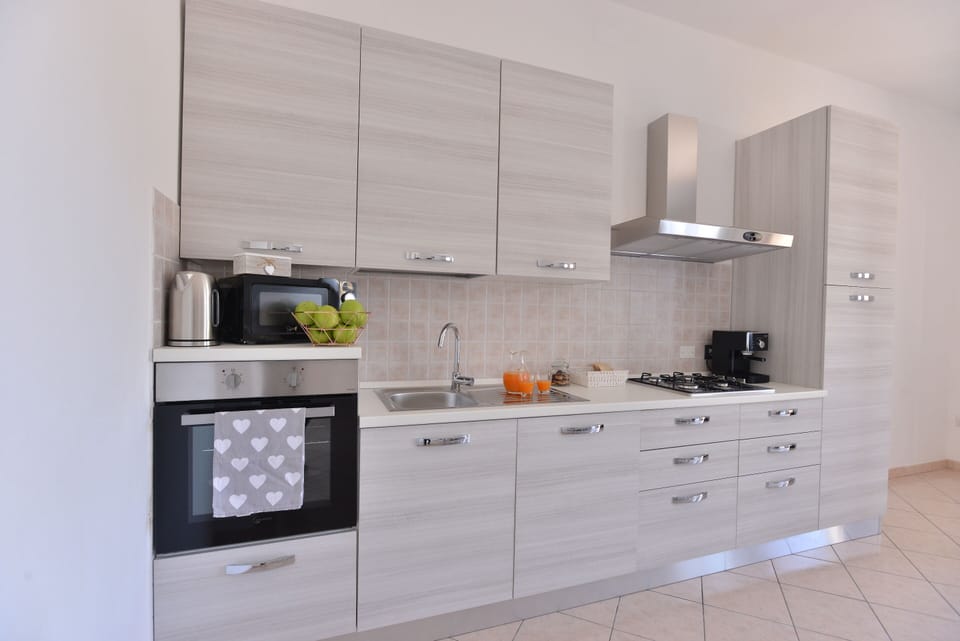 Apartment | Private kitchen | Full-size fridge, microwave, oven, espresso maker