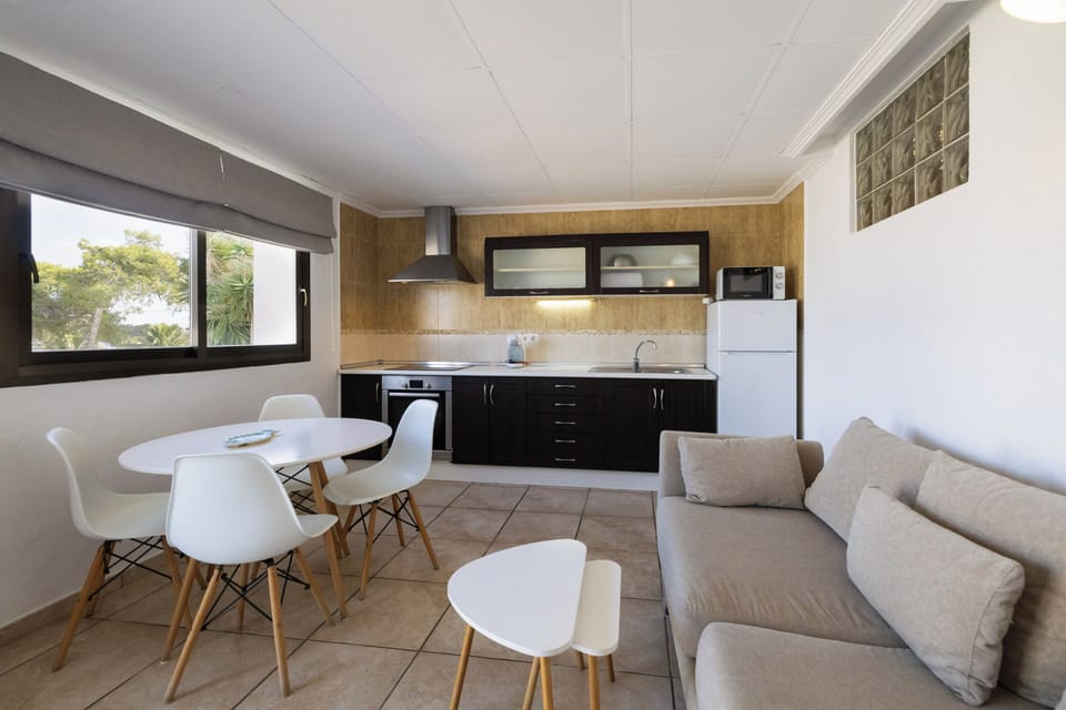 Family Apartment, 2 Bedrooms, Pool Access, Sea View | Living area | 30-inch flat-screen TV with satellite channels, TV