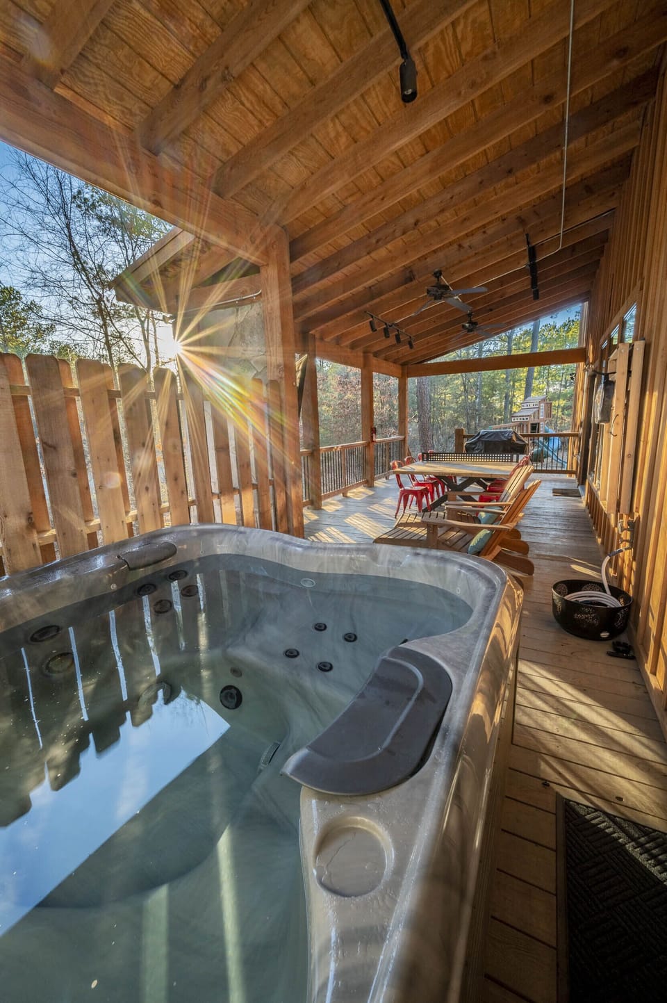 Indulge in a luxurious soak in the hot tub, while your fellow guests enjoy the back deck's entertainment options - from catching up on TV to firing up the gas BBQ grill or engaging in a lively game of ping pong.