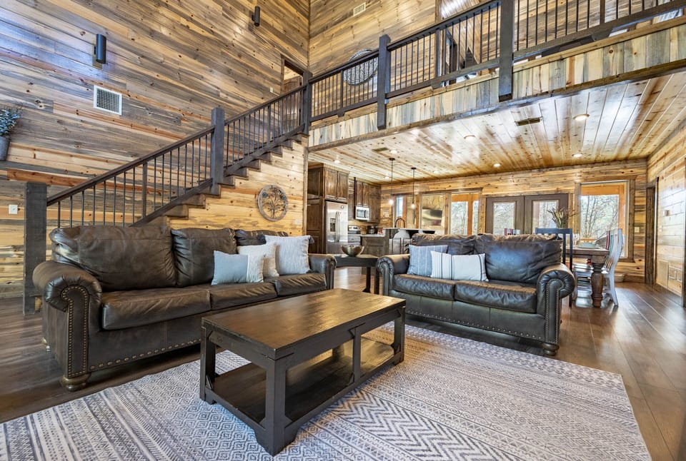 At Daydream Believer, an open concept living area is the central feature, with a cozy gas fireplace and plenty of seating.