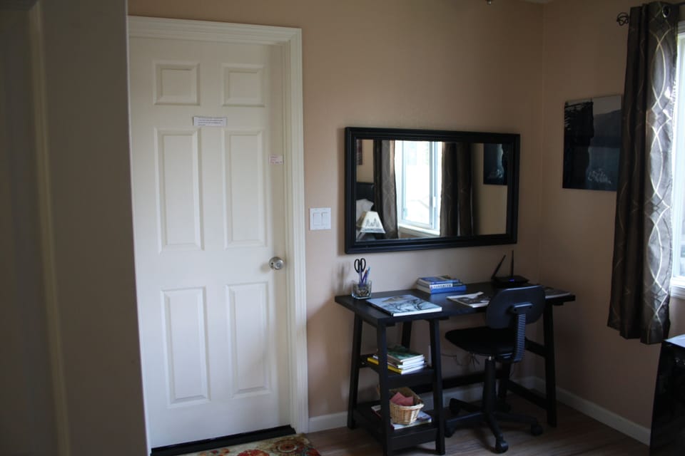 desk / work area ... door to laundry room and private deck   