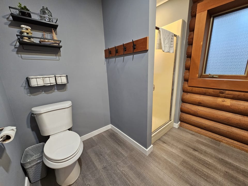 Hall bathroom - Shower, new vanity, 4-hook towel rack, and washer & dryer