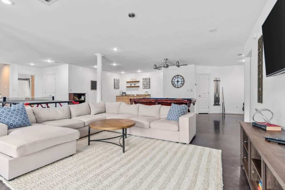 Downstairs game room with pool, ping pong and TV