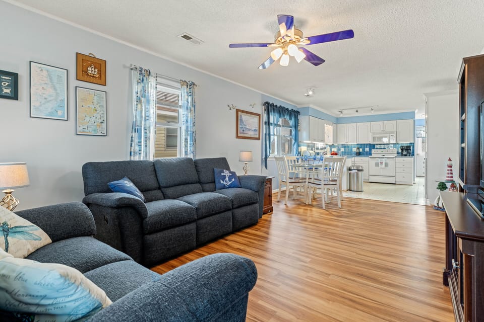 Sunroom leads to open floorplan with easy access to common areas