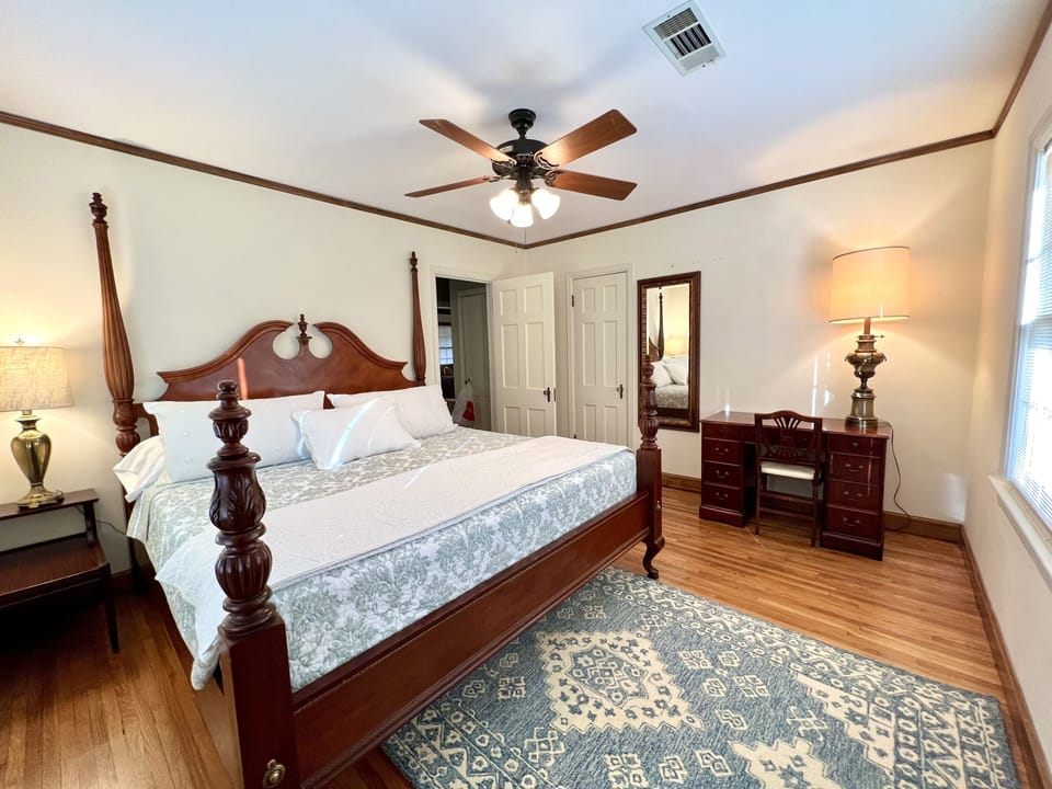 King bedroom w/ desk, nice-sized closet, and ceiling fan