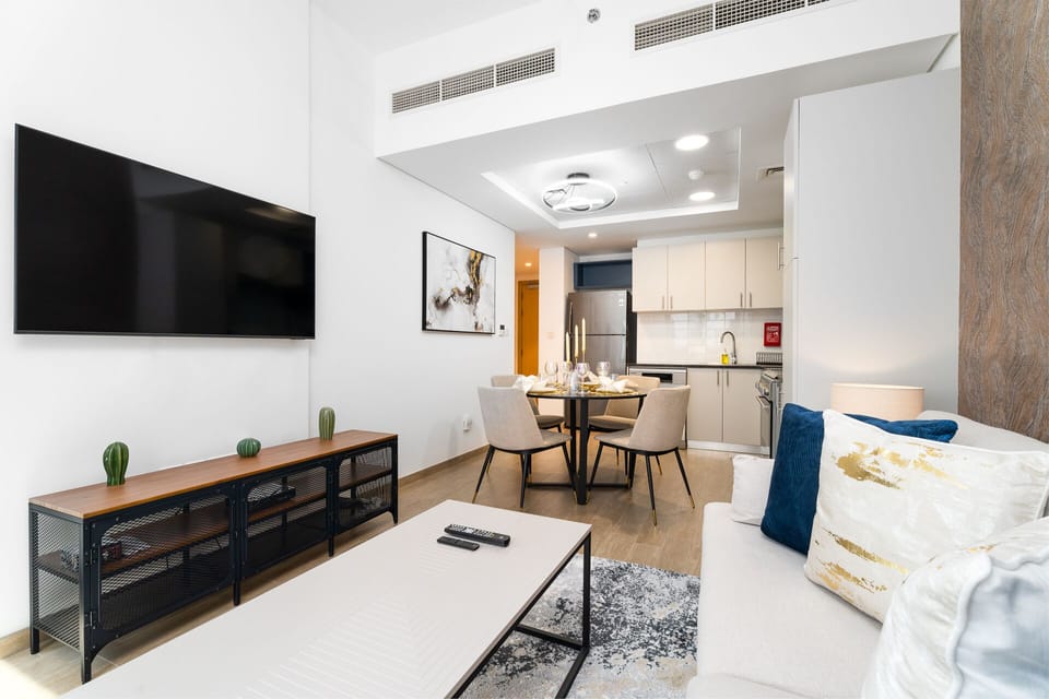 Deluxe Apartment | Living area | 55-inch Smart TV with cable channels, TV