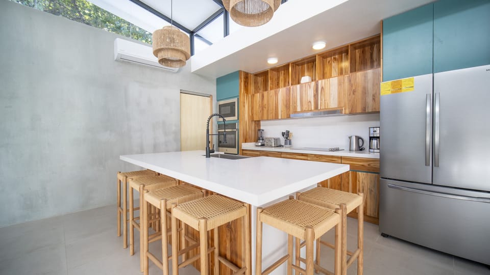 Spacious kitchen, luxury furnishings, and bar seating