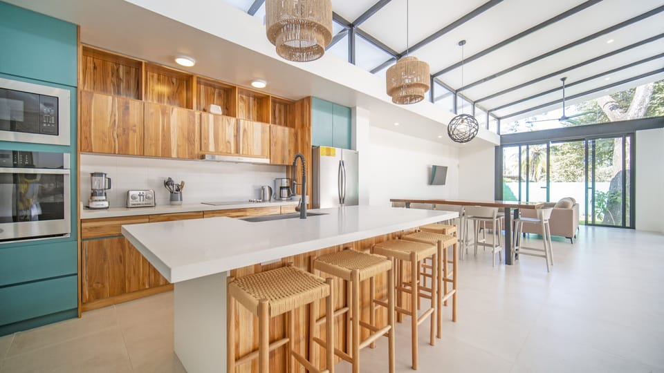 Spacious kitchen, luxury furnishings, and bar seating