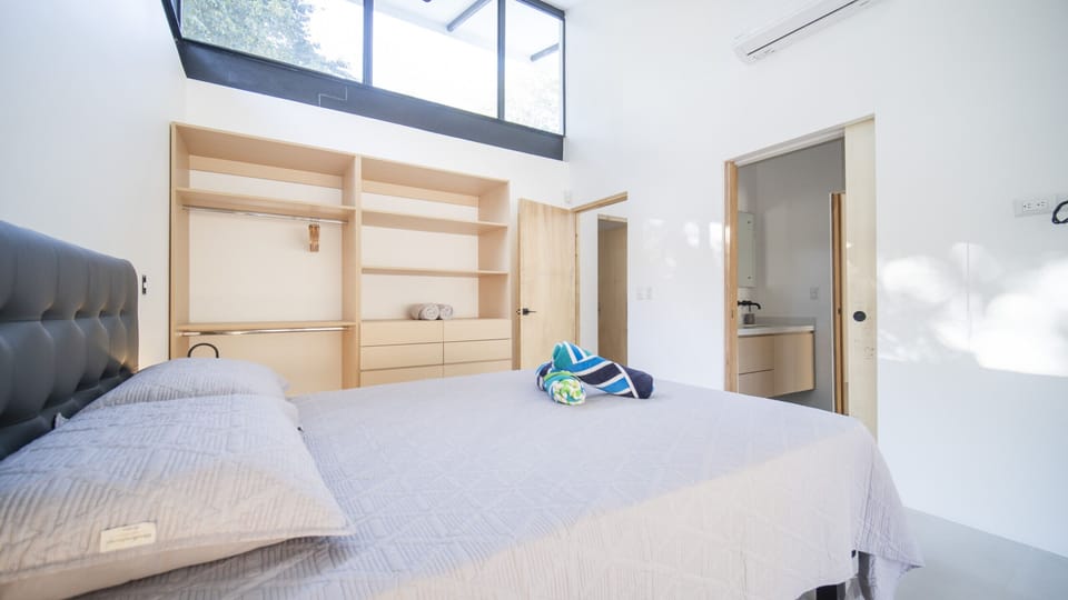 Wake up in a master suite with a private bath, embraced by nature