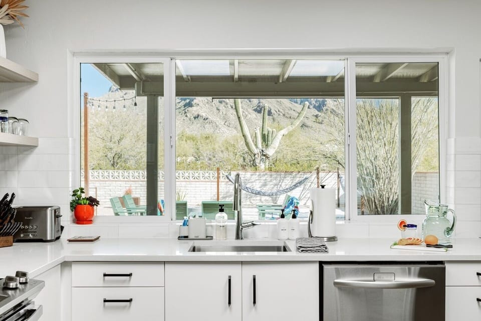 The kitchen overlooks a private desert oasis for a comfortable, easy stay.