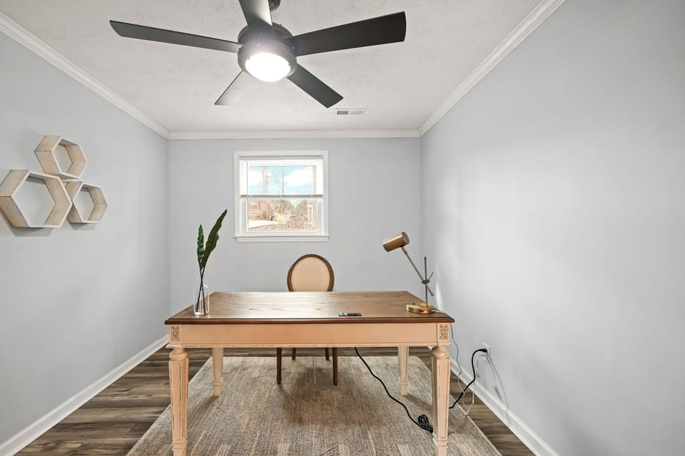 Tranquil office space with a beautiful lamp.