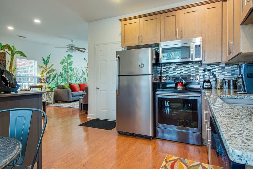 Downstairs Fully equipped kitchen with stainless fridge with ice-maker, stove, microwave and dishwasher