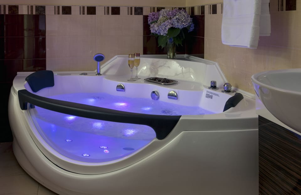 Romantic Occasion | Bathroom | Free toiletries, hair dryer, bathrobes, slippers
