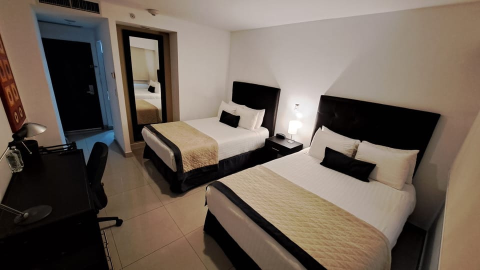Standard Double Room, 2 Double Beds | In-room safe, desk, laptop workspace, blackout drapes