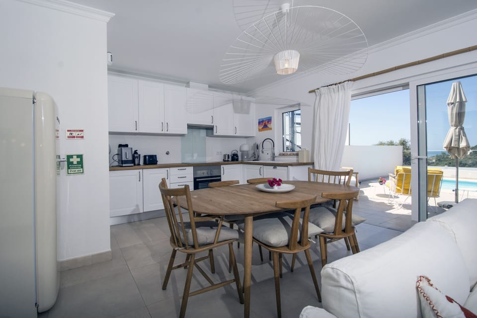 Bright kitchen with wooden dining table