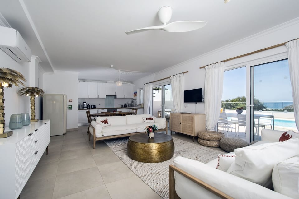 Bright living room with air conditioning and open kitchen