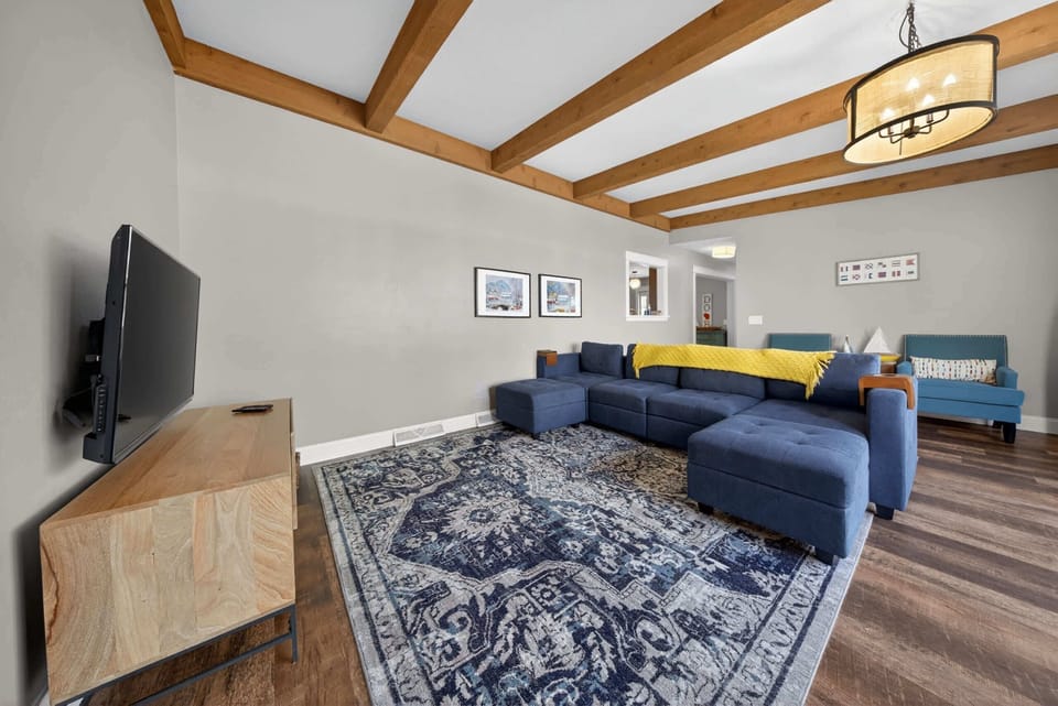 Large couch and tv in living room