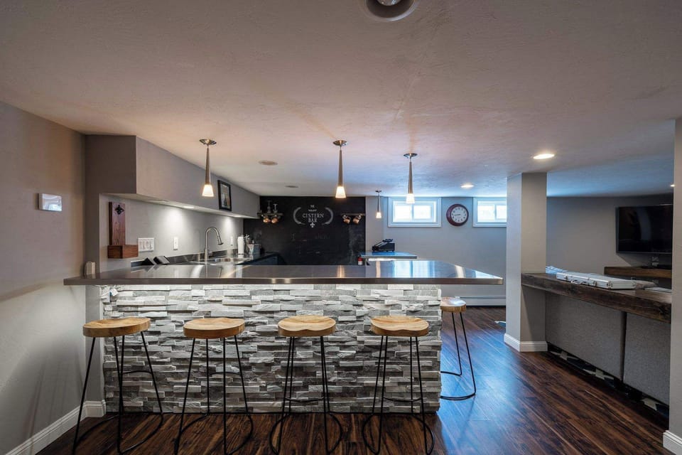 Pull up seat at the expansive bar in the basement