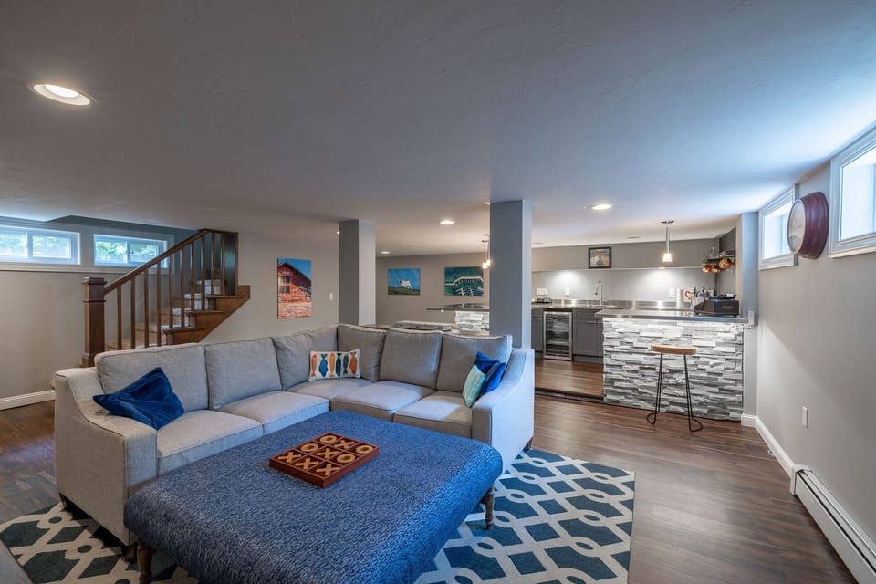 Transition to the lowest level with a second full living space and wet bar