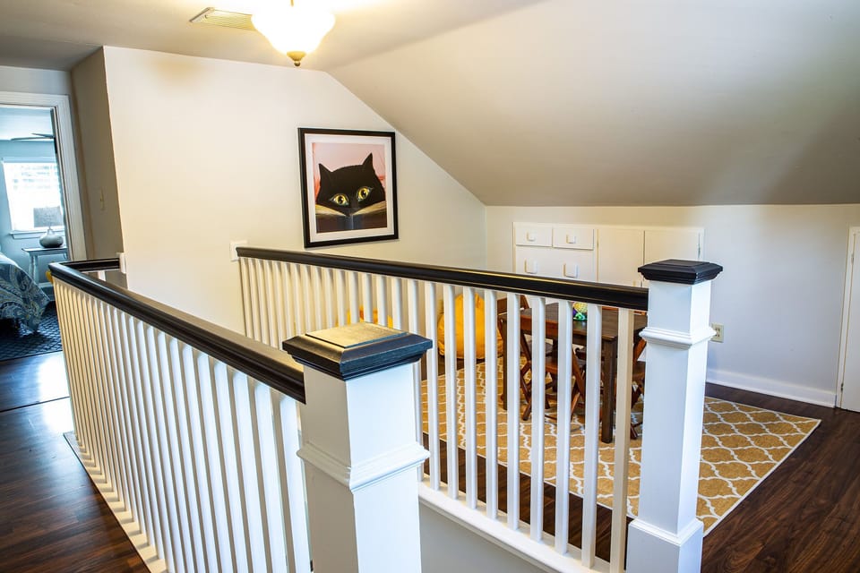 Children's loft at top of stairs.  Bean bags, table and chairs, games & books.
