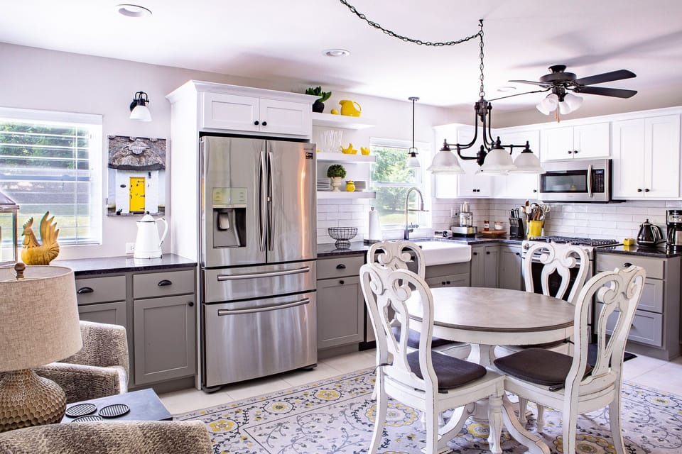 Fully equipped modern kitchen w/ an extra sitting area to be part of the action.