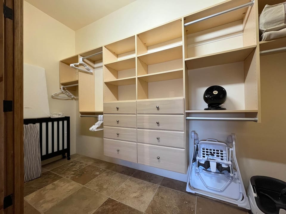 Main bedroom closet with ample space and kid's amenities