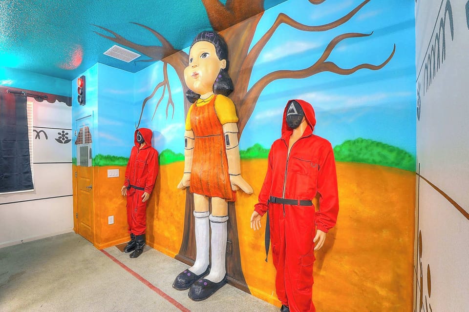 MAIN LEVEL: Prepare yourself for an exhilarating experience with the Squid Game-themed suite designed for 6 players. Who will emerge as the champion in this intense game of green light, red light? En-suite master bathroom with shower, walk in closet 