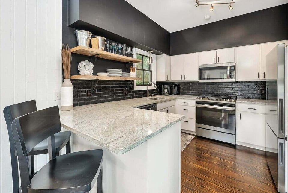 Modern kitchen with stainless steel appliances and a peninsula