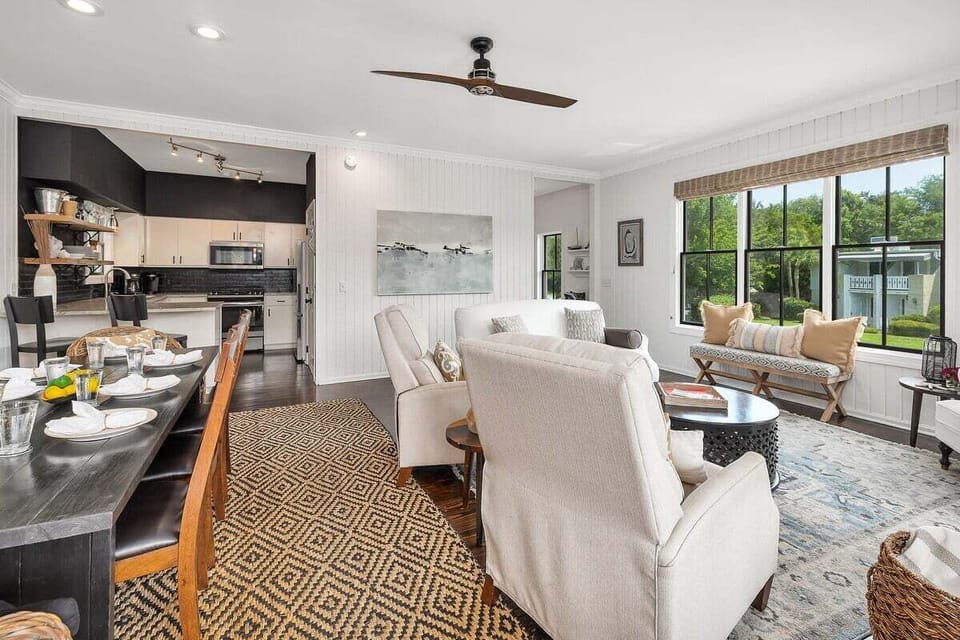 Open living area connecting to kitchen and dining space