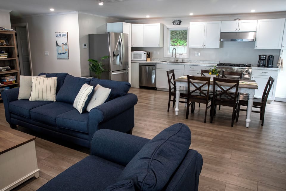 Open concept floor plan with adjoining kitchen and living room