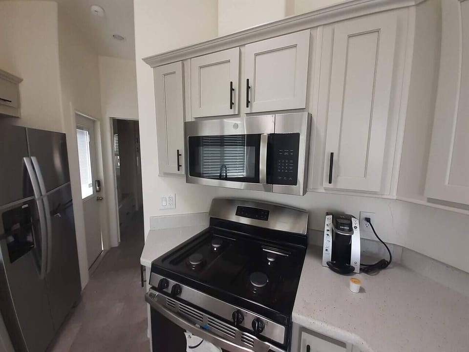 Full Kitchen with refrigerator. 