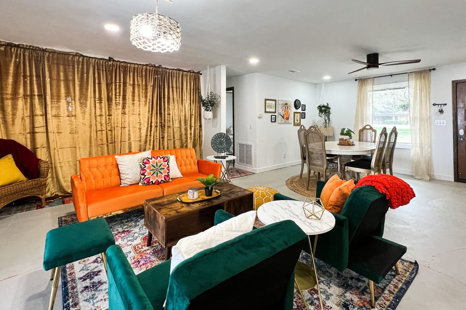 Livingroom,  dining room, and master suite with curtains closed for privacy.
