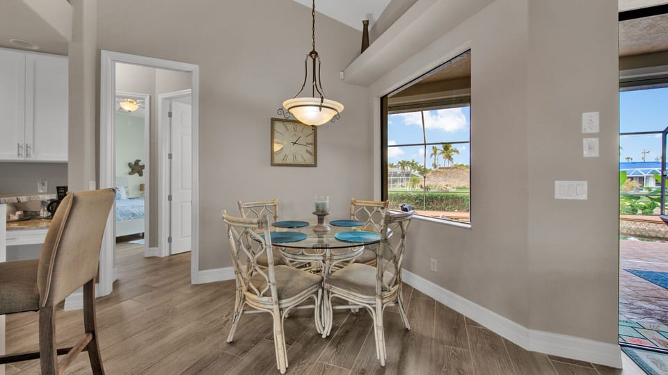 Dining area with seating for four people.