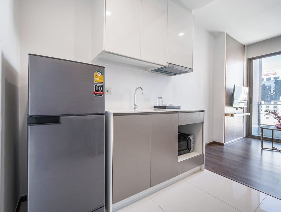 1 Bedroom King | Private kitchen | Fridge, microwave, electric kettle, dining tables