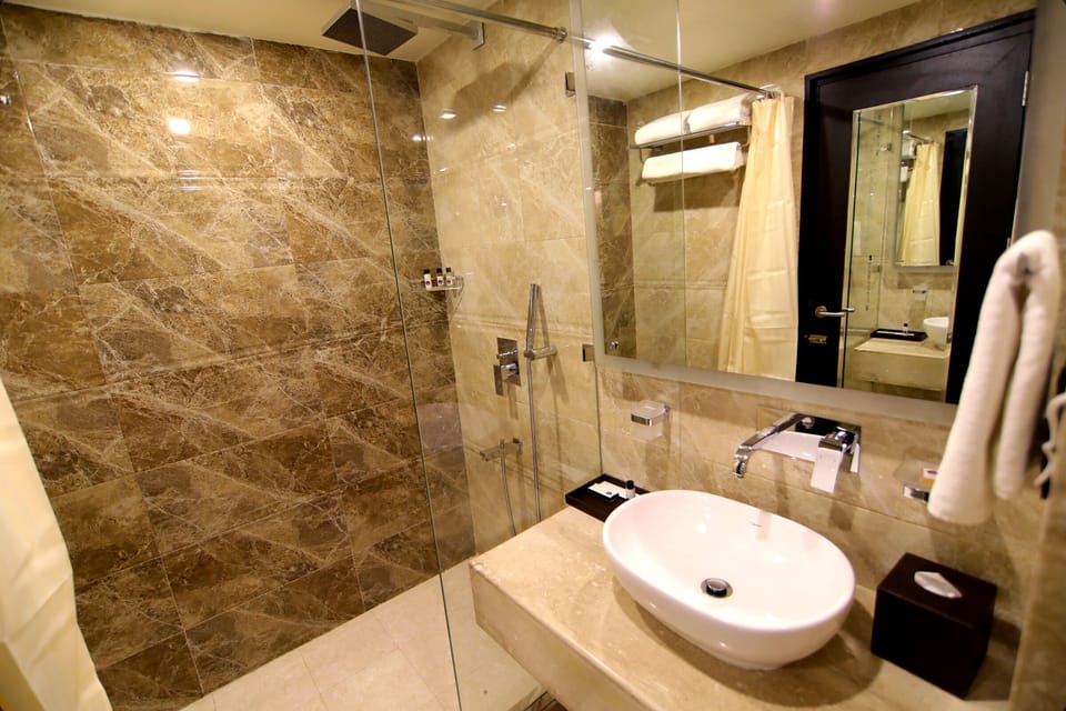 Shower, free toiletries, hair dryer, slippers