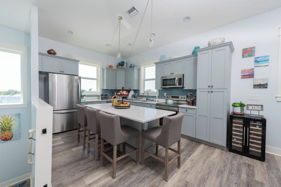 Open Concept Chef's Kitchen with Large Quartz Island and Seating (1)