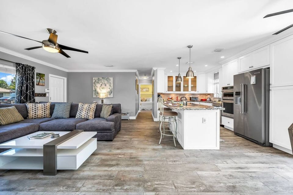 The perfect family room to read, play and enjoy. The living room is open and spacious. Enjoy the 55" TV with cable and smart apps. The room is perfectly located with easy access to all spaces in the home. The large windows bring in ample lighting.