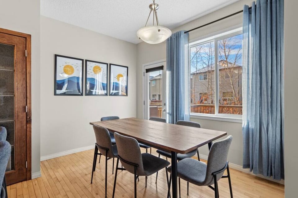 Dining area with seating for 6 at the table and 3 at the island.