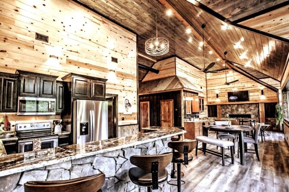 The perfect space for entertaining! Enjoy the wine bar and gather around one of the many seating areas, kitchen, or wrap around deck.