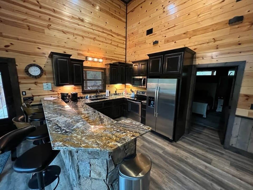 Fully stocked kitchen with coffee bar and granite counter tops. 