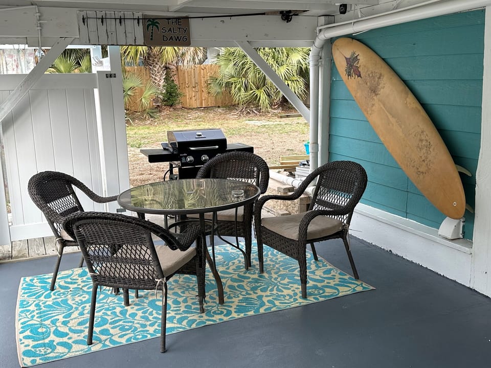 Downstairs patio with BBQ.  The door in the photo is the laundry room and door next to that is entrance to studio