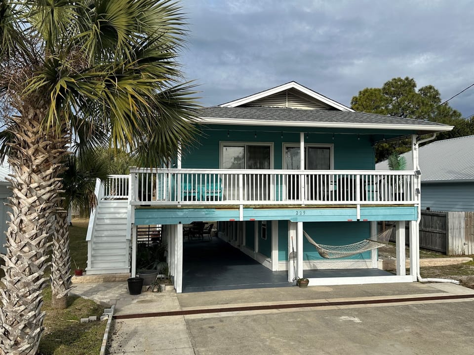 Escape to a world of seaside charm and cozy elegance at this enchanting Florida cottage, where sunny days and balmy nights are always in season 
