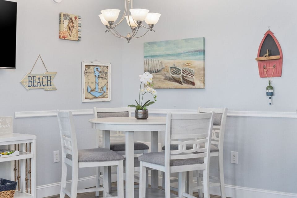 Savor your meals or enjoy a lively card game in this inviting nook, where comfort and charm create the perfect spot for gathering and making memories.