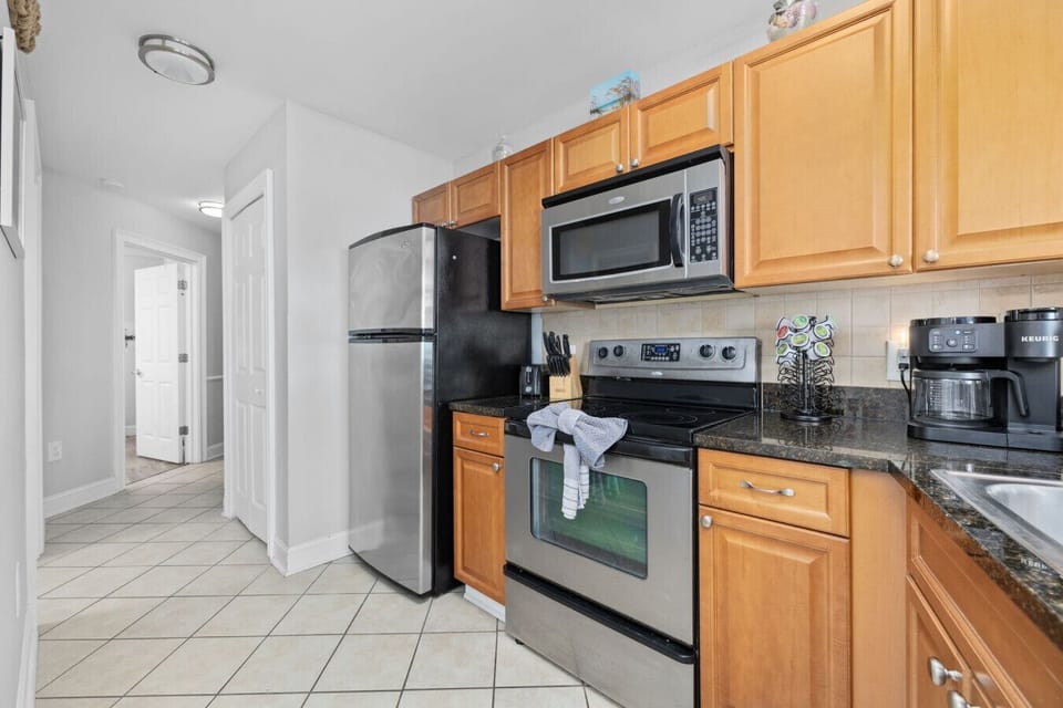 The kitchen is designed to be user-friendly, whether you`re a seasoned chef or just brewing your morning coffee. It`s stocked with all the essential utensils to make cooking easy and enjoyable for everyone.